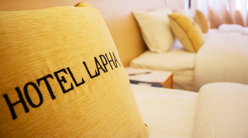 Picture of a cushion in a deluxe room in Hotel Lapha with the hotel's name